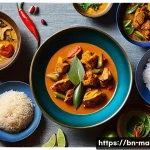 말레이시아와 인도네시아 음식의 차이점 - A vibrant Malaysian festive dining scene showcasing a variety of traditional dishes arranged on eleg...